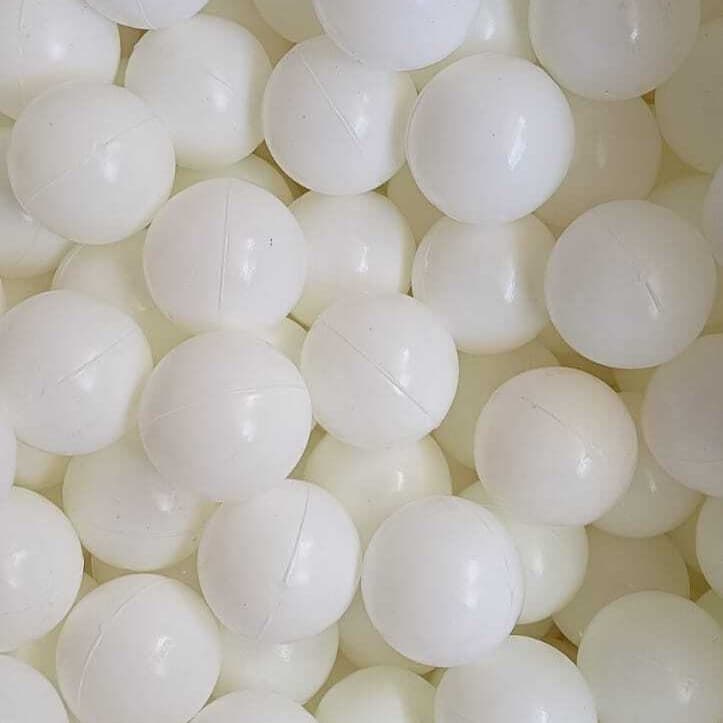 Open bulk bag of white play balls