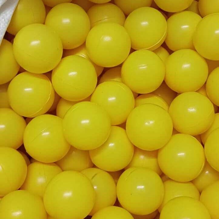 Open bulk bag of yellow play balls