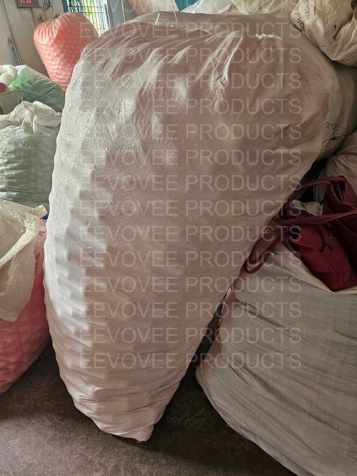 Large bulk cargo bags filled with play balls, stacked and ready for dispatch