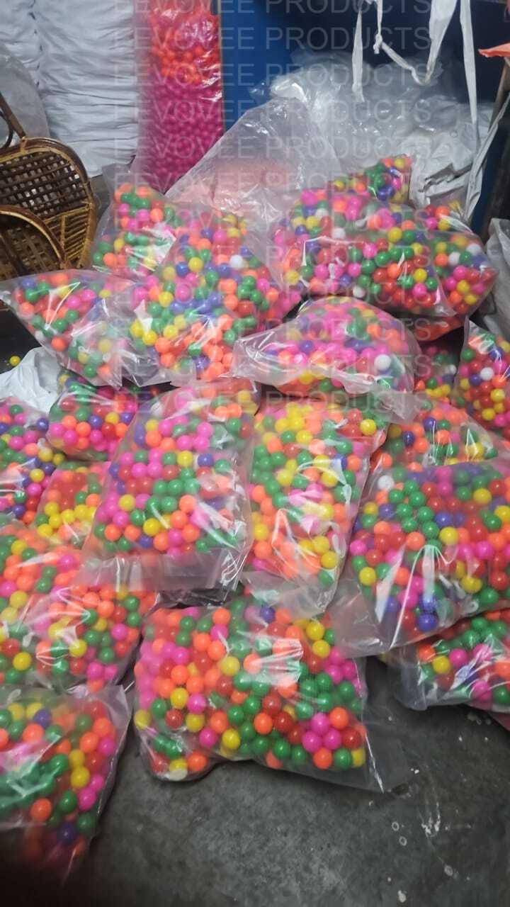 Filled plastic bags of multicoloured play balls stacked for retail packing