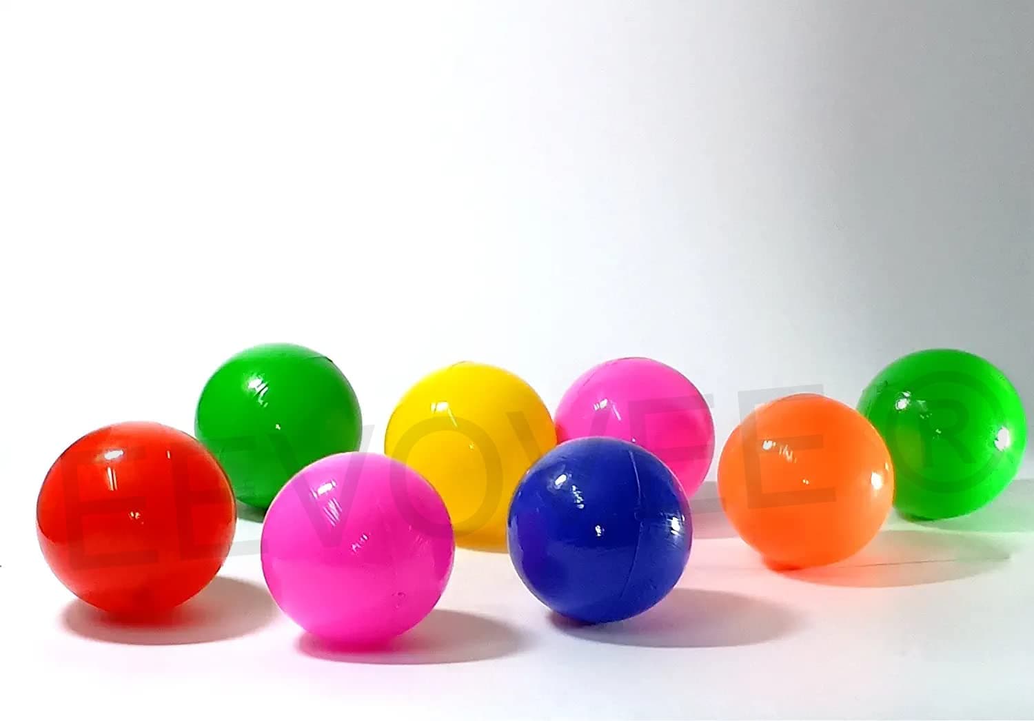 Multiple colorful kids play balls together